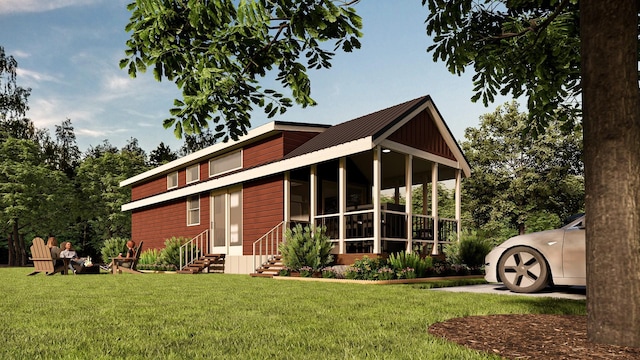 view of front of house with a sunroom and a front lawn