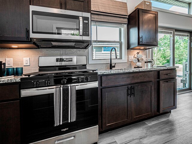 197 Wheeler Rd, Florida, NY 10921 - kitchen featuring appliances with stainless steel finishes, plenty of natural light, light wood-style floors, and light stone countertops