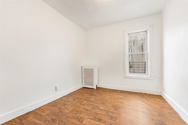 empty room with wood-type flooring