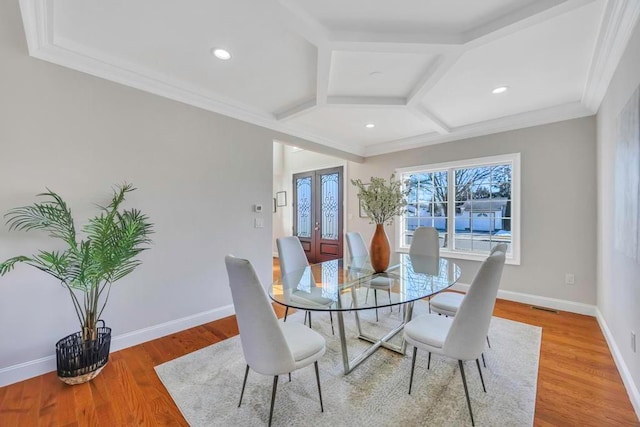 dining area with french doors, wood-type flooring, coffered ceiling, and beam ceiling