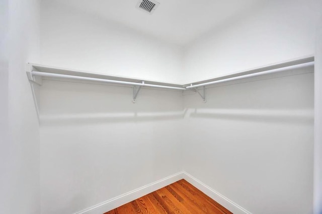 walk in closet featuring wood-type flooring