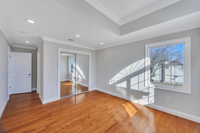 interior space featuring crown molding and wood-type flooring