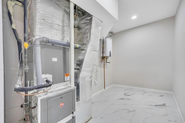 utility room with heating unit and tankless water heater