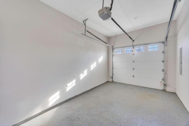 garage featuring a garage door opener and electric panel