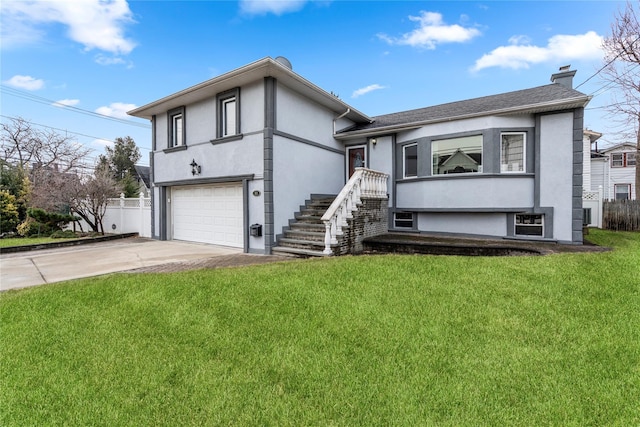 view of front facade with a garage and a front lawn