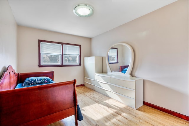 bedroom with light hardwood / wood-style flooring