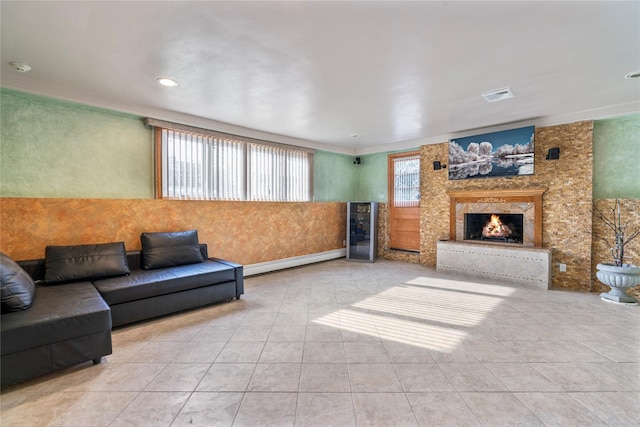 tiled living room featuring a baseboard radiator