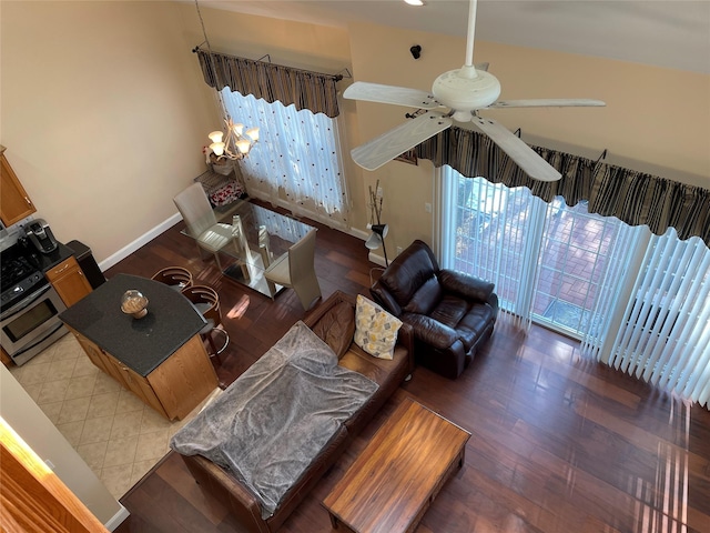 living room featuring wood-type flooring and ceiling fan