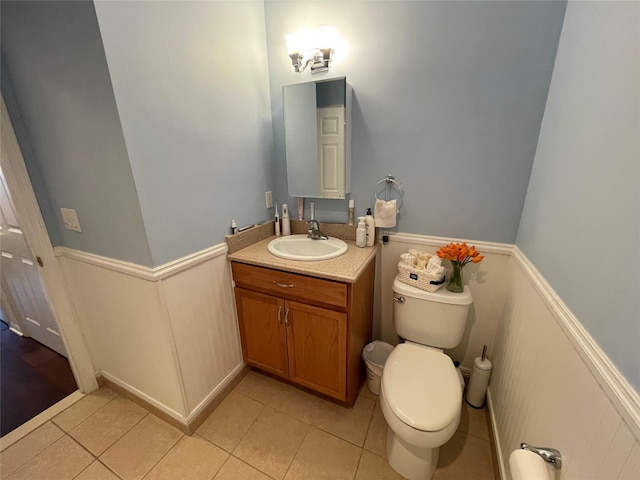 bathroom with vanity, tile patterned floors, and toilet