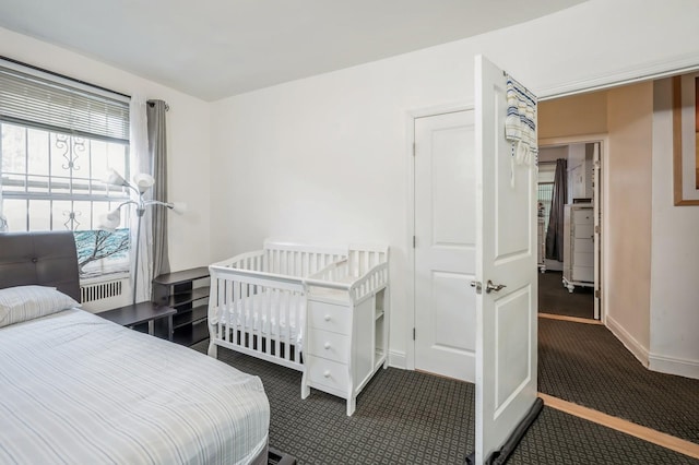 bedroom with dark carpet