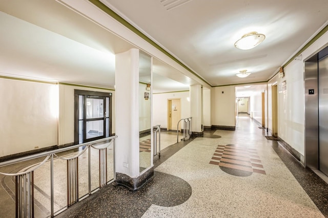 corridor featuring ornamental molding