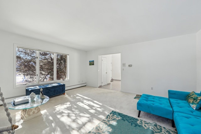 sitting room featuring baseboard heating and light carpet