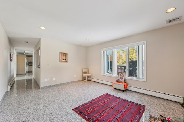 living area featuring a baseboard radiator