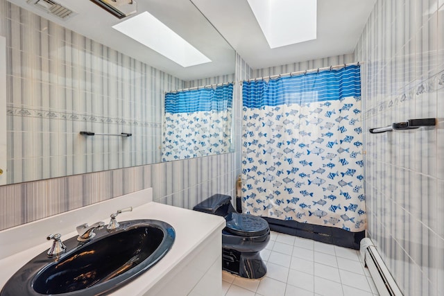 bathroom with a skylight, tile patterned flooring, vanity, a baseboard heating unit, and toilet