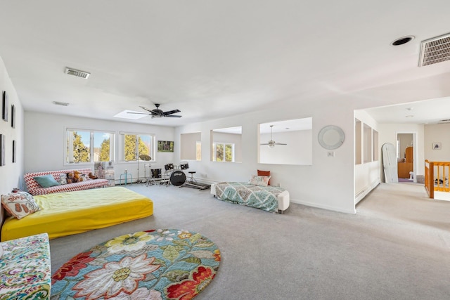 carpeted living room with ceiling fan