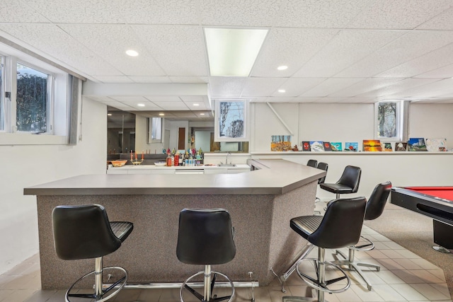 bar with a paneled ceiling