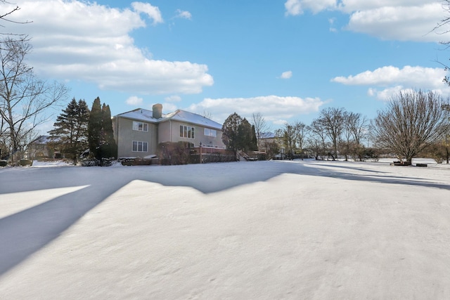 view of yard layered in snow