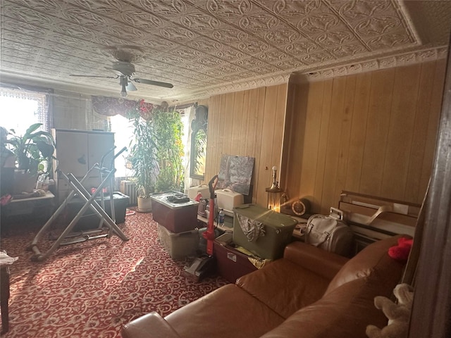 misc room featuring wooden walls and ceiling fan