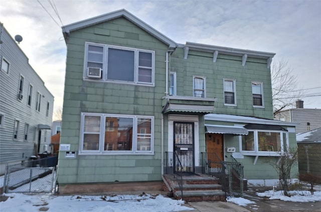 view of front of home featuring cooling unit