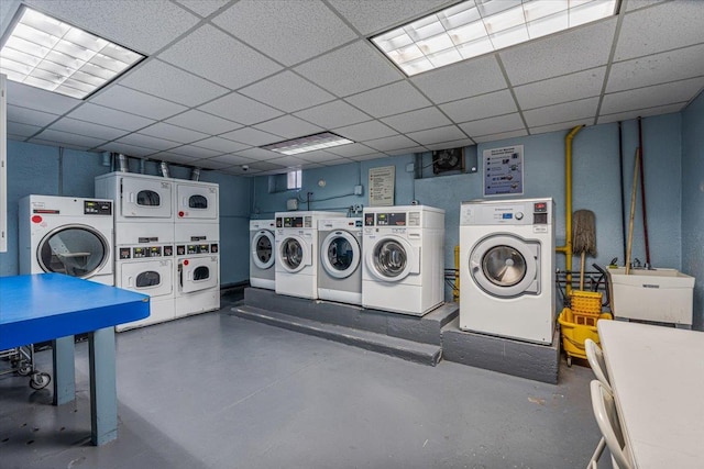 laundry room with sink, washer and dryer, and stacked washing maching and dryer