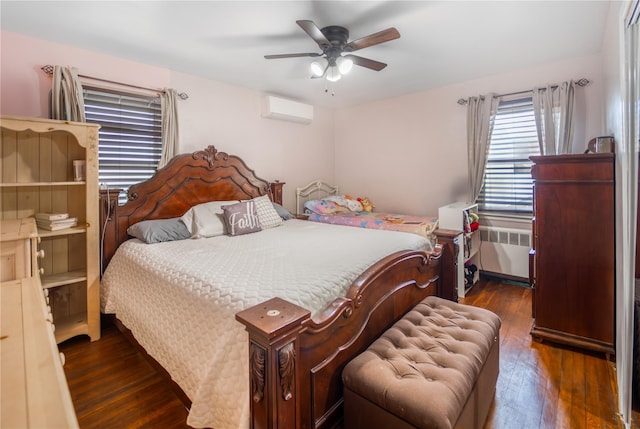 bedroom featuring ceiling fan, dark hardwood / wood-style floors, radiator, and a wall unit AC