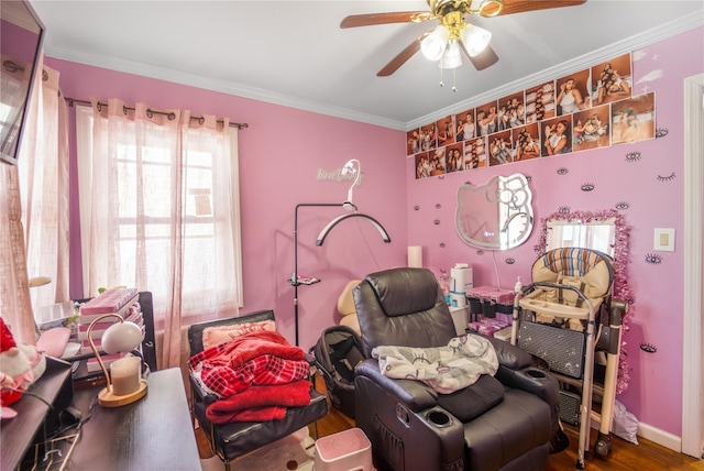 bedroom with crown molding, ceiling fan, and hardwood / wood-style flooring