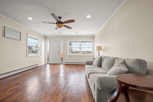 living room with crown molding, a baseboard heating unit, and dark hardwood / wood-style flooring