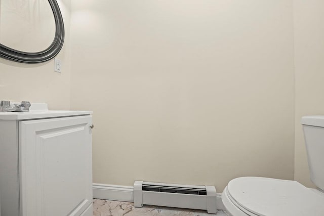 bathroom featuring vanity, a baseboard radiator, and toilet