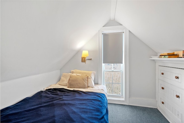 carpeted bedroom featuring lofted ceiling