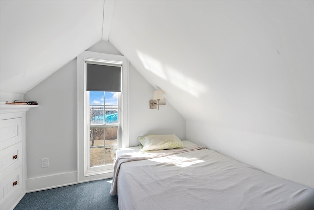 carpeted bedroom featuring vaulted ceiling