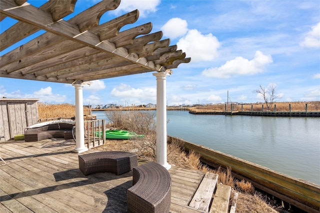 dock area featuring a water view and a pergola