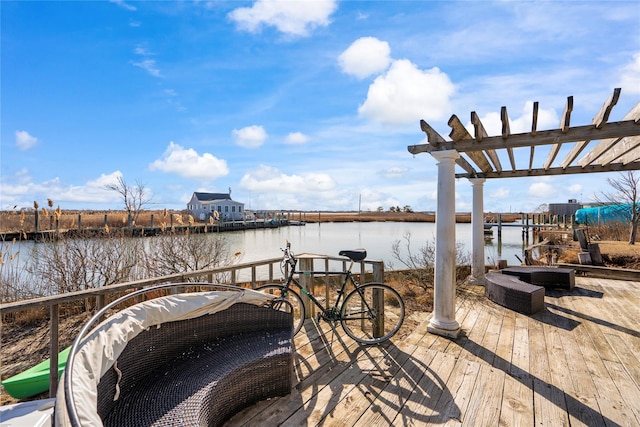 view of dock featuring a pergola and a water view