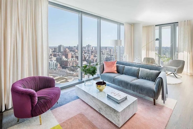 living room featuring floor to ceiling windows and hardwood / wood-style floors