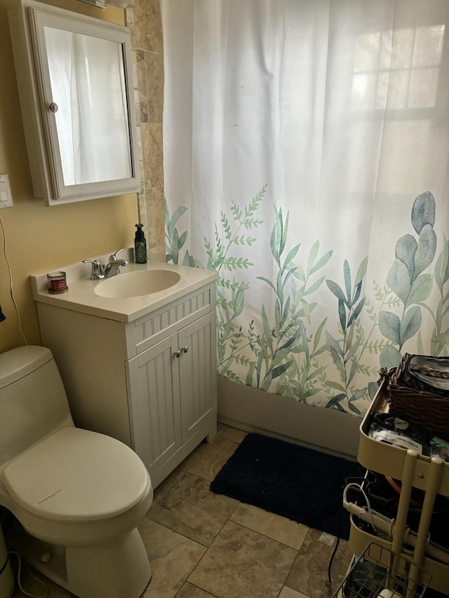 bathroom with vanity and toilet