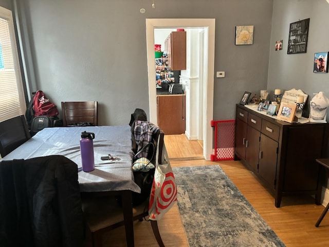 dining space with light hardwood / wood-style floors