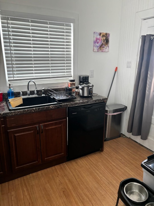 kitchen featuring dark brown cabinetry, sink, light hardwood / wood-style flooring, and dishwasher