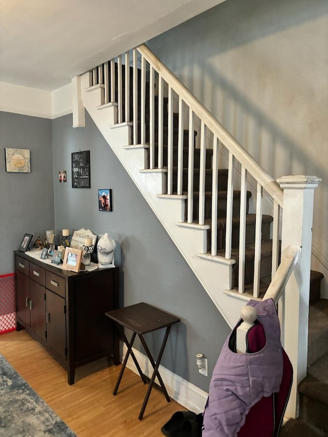 staircase featuring hardwood / wood-style floors