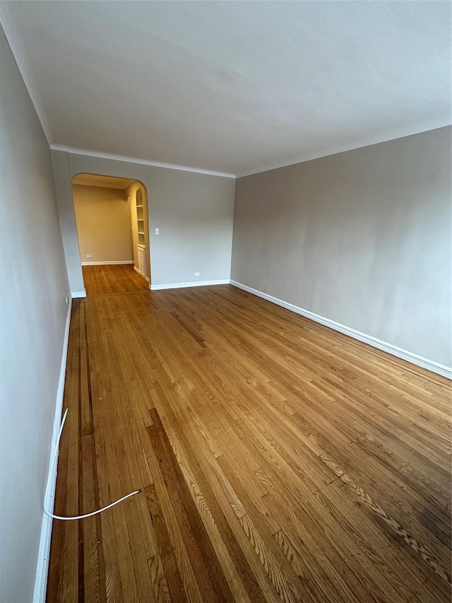 empty room featuring wood-type flooring