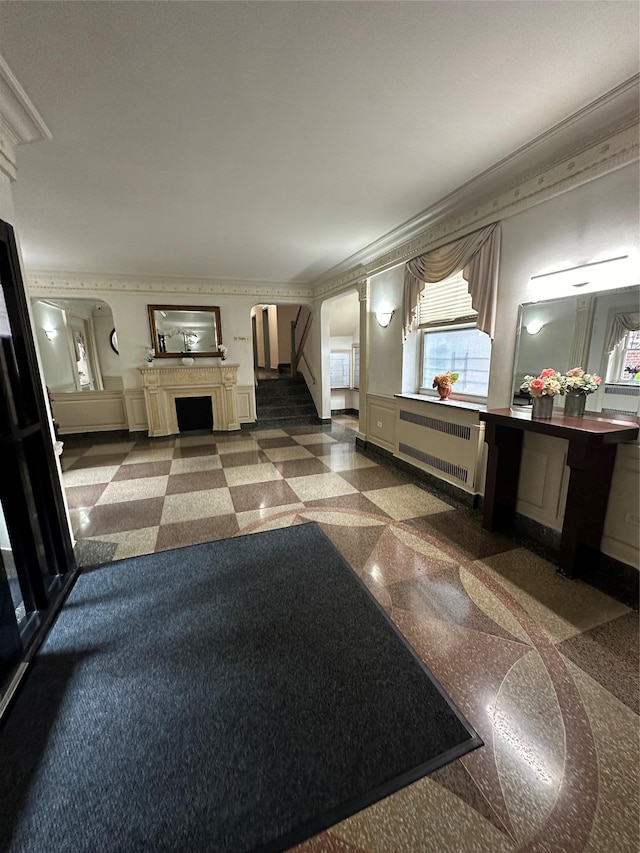 interior space with radiator and ornamental molding