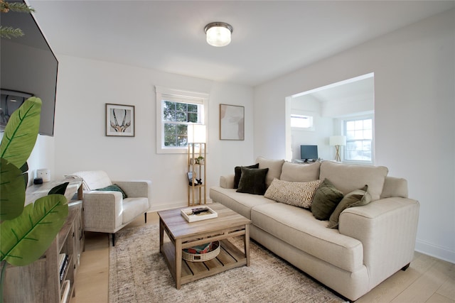 living room featuring light hardwood / wood-style flooring and a wealth of natural light