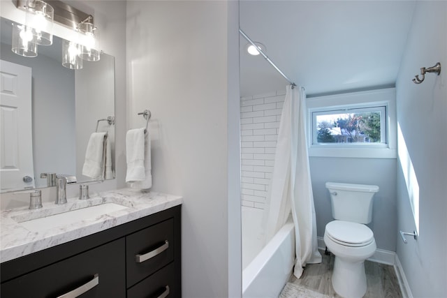 full bathroom with vanity, toilet, and shower / bath combo with shower curtain