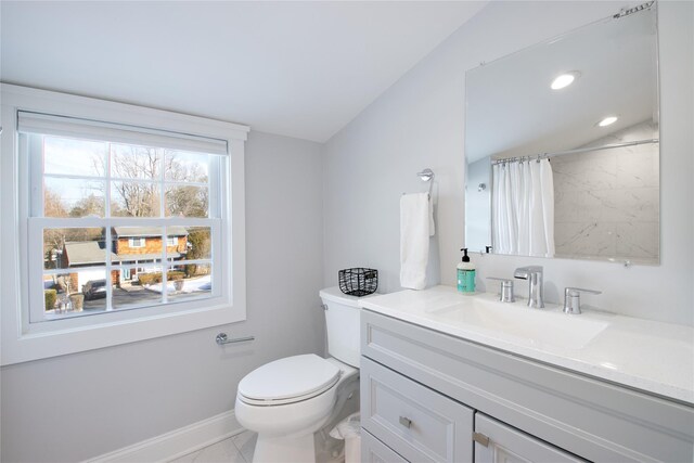 bathroom featuring vanity, a shower with curtain, lofted ceiling, and toilet