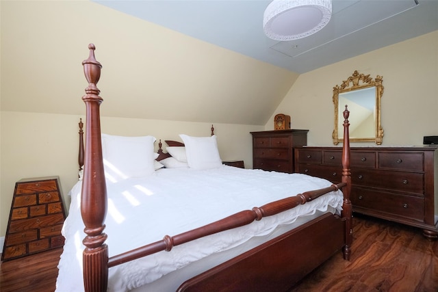 bedroom featuring vaulted ceiling and dark wood-type flooring