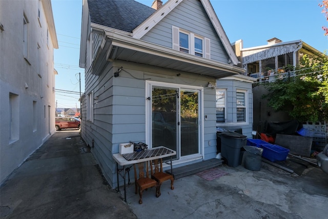 rear view of property featuring a patio