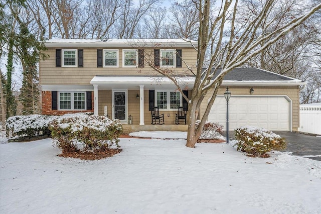 view of front of home with a garage and a porch