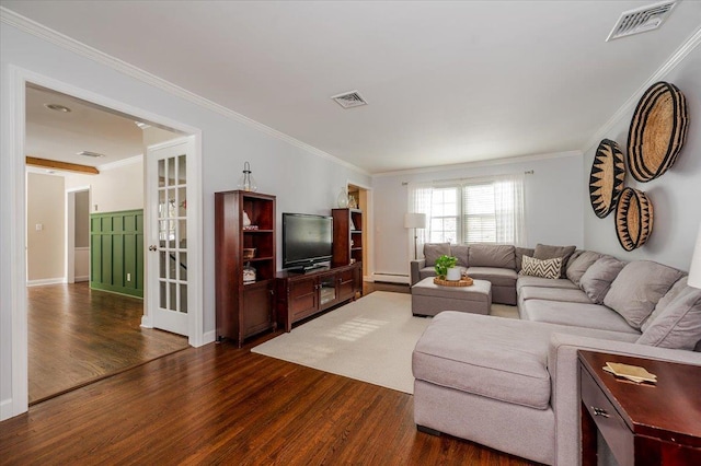 living room featuring a baseboard heating unit, crown molding, and dark wood-type flooring