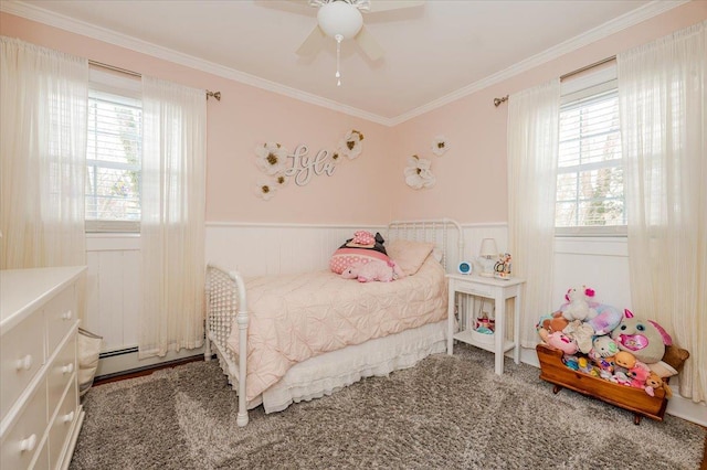 carpeted bedroom with ornamental molding, ceiling fan, and baseboard heating