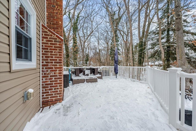 view of snow covered deck