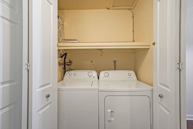 laundry area with washing machine and dryer