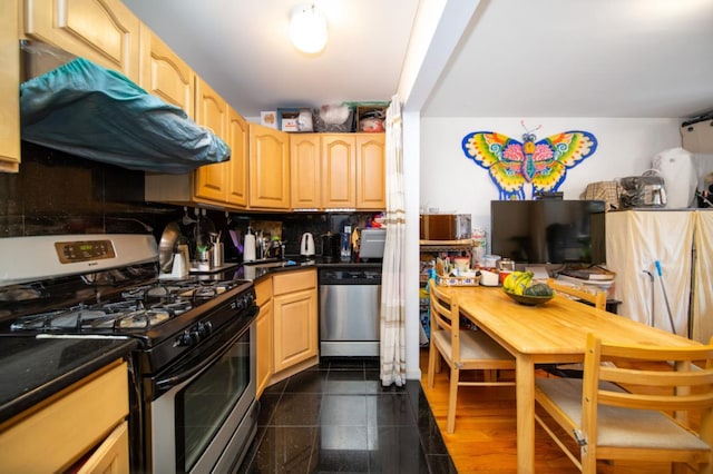 kitchen with light brown cabinetry and stainless steel appliances